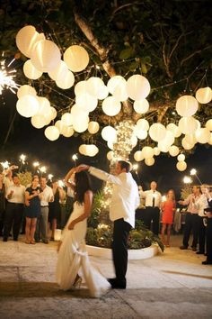 outside wedding reception with paper lantern / http://www.deerpearlflowers.com/romantic-wedding-lightning-ideas/